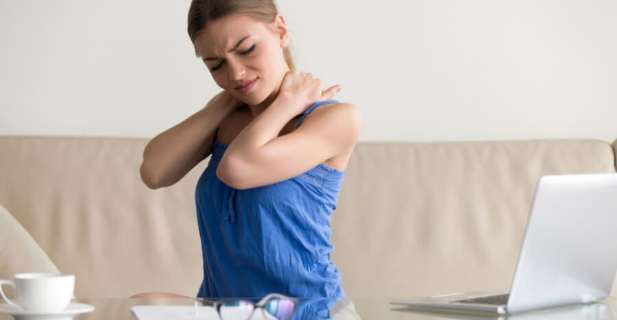 Woman experiencing neck pain