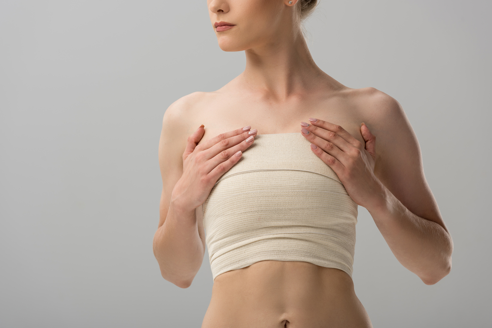 Woman with bandages around her breast