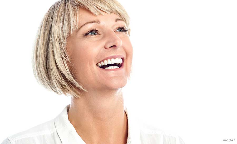 woman wearing white smiling