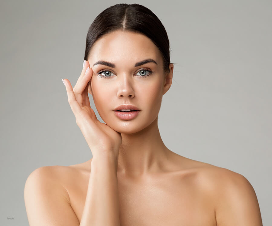 Model with brown hair and lifted brows